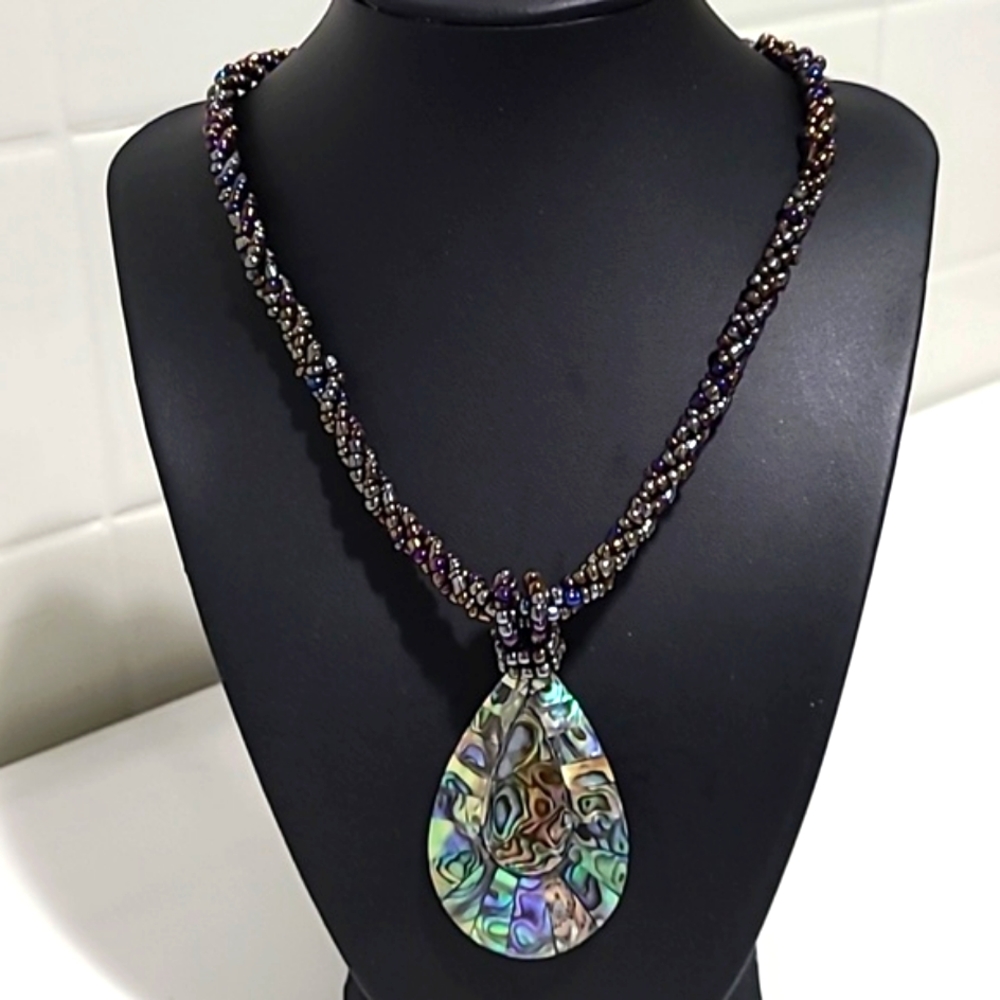 Unknown beaded necklace with stone pendant chic glam unique festive classic